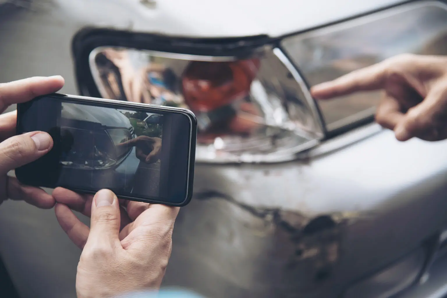 Driver reviewing auto insurance policy documents after a car accident in Washington